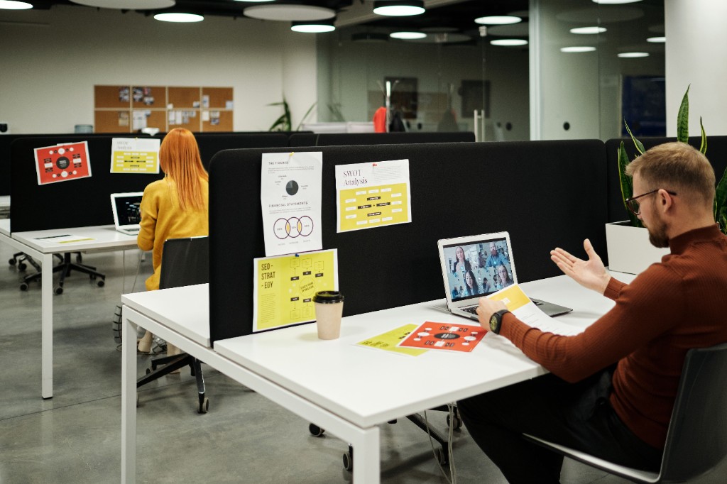 Hybrid desks with a video call in progress