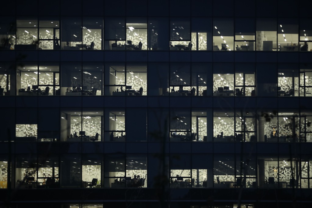 Office building facade lit at night
