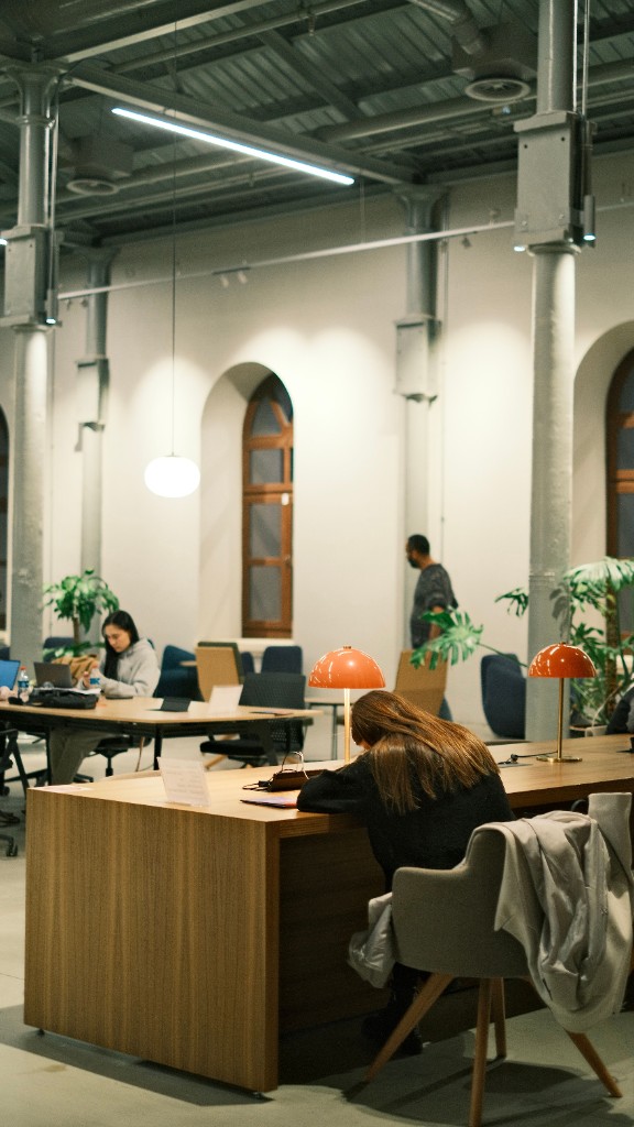 People working in an open coworking space